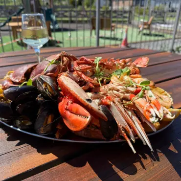 Seafood platter with lobster, mussels and crab, served on the terrace