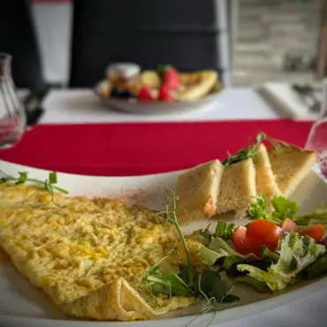 Omelette with a side salad and toasted bread