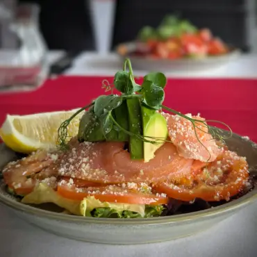 Smoked salmon salad with avocado and lemon