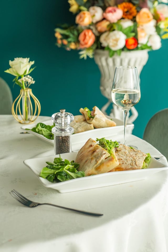 Table set with panini and wine