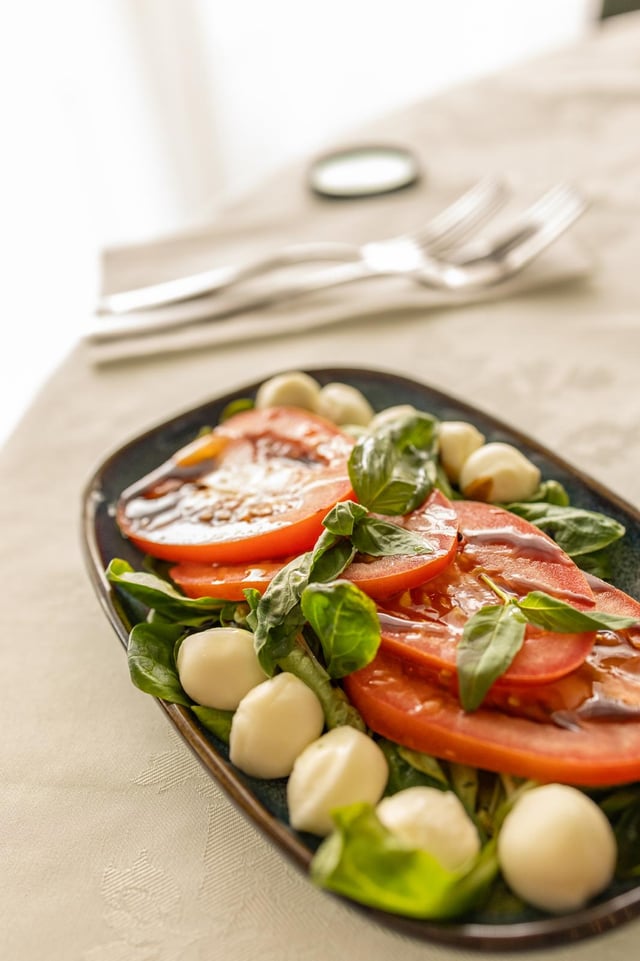 Caprese salad with heirloom tomato, mozzarella and basil