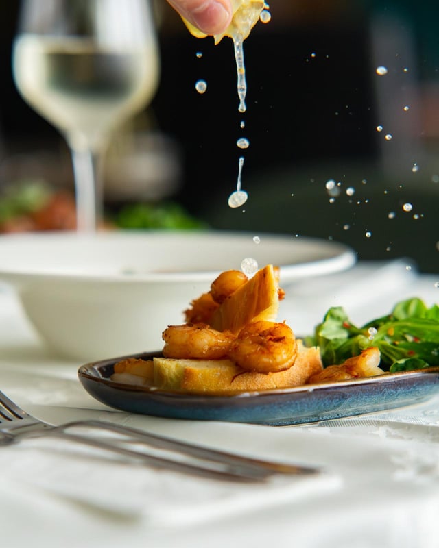 Pan-seared scampi finished tableside