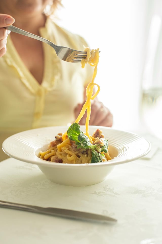 Fresh hand-pulled tagliatelle tossed with ragù