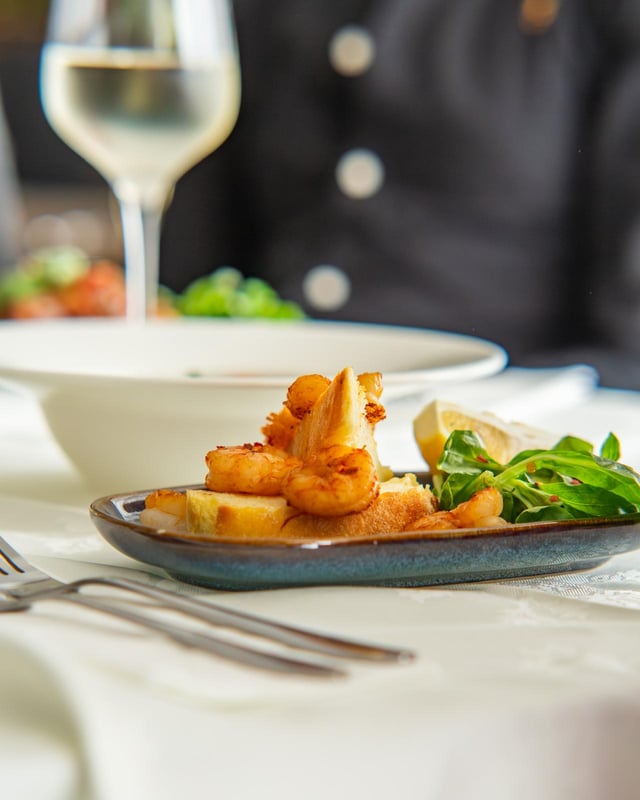 Pan-seared shrimp with crostini and arugula